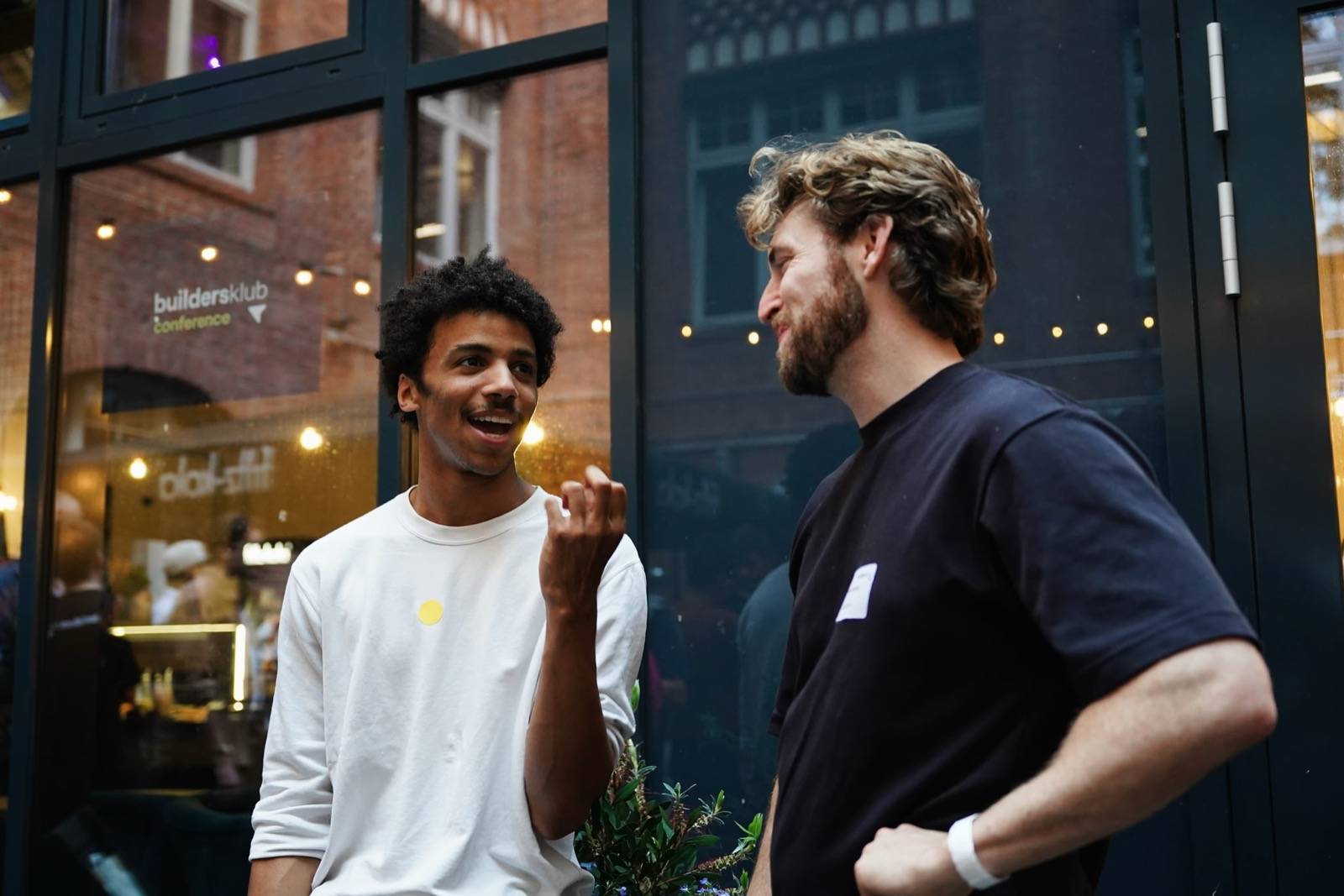 Two attendees deep in conversation