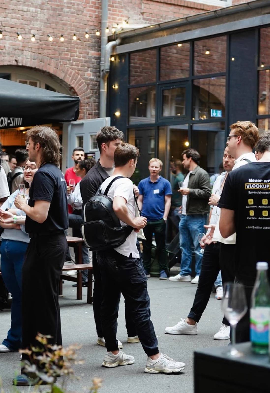 Attendees in the courtyard between sessions