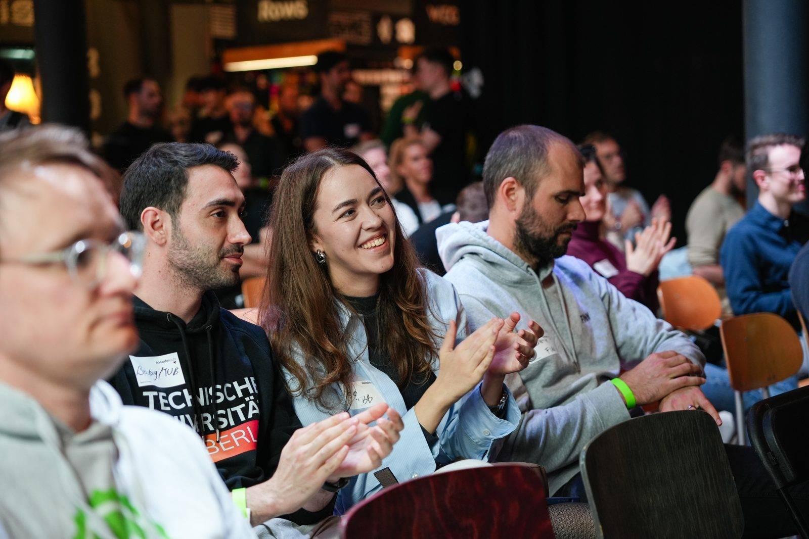 Attendees laughing during a session